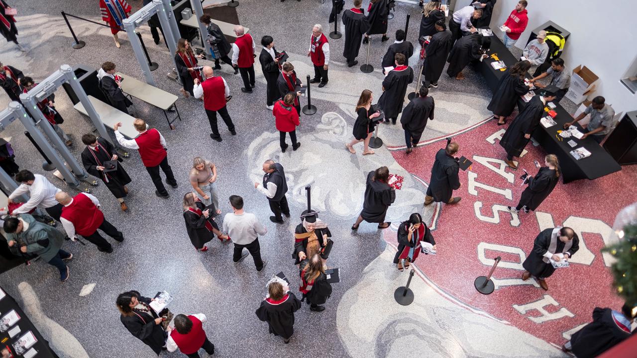 Graduates getting signed in for commencement at the Schottenstein Center